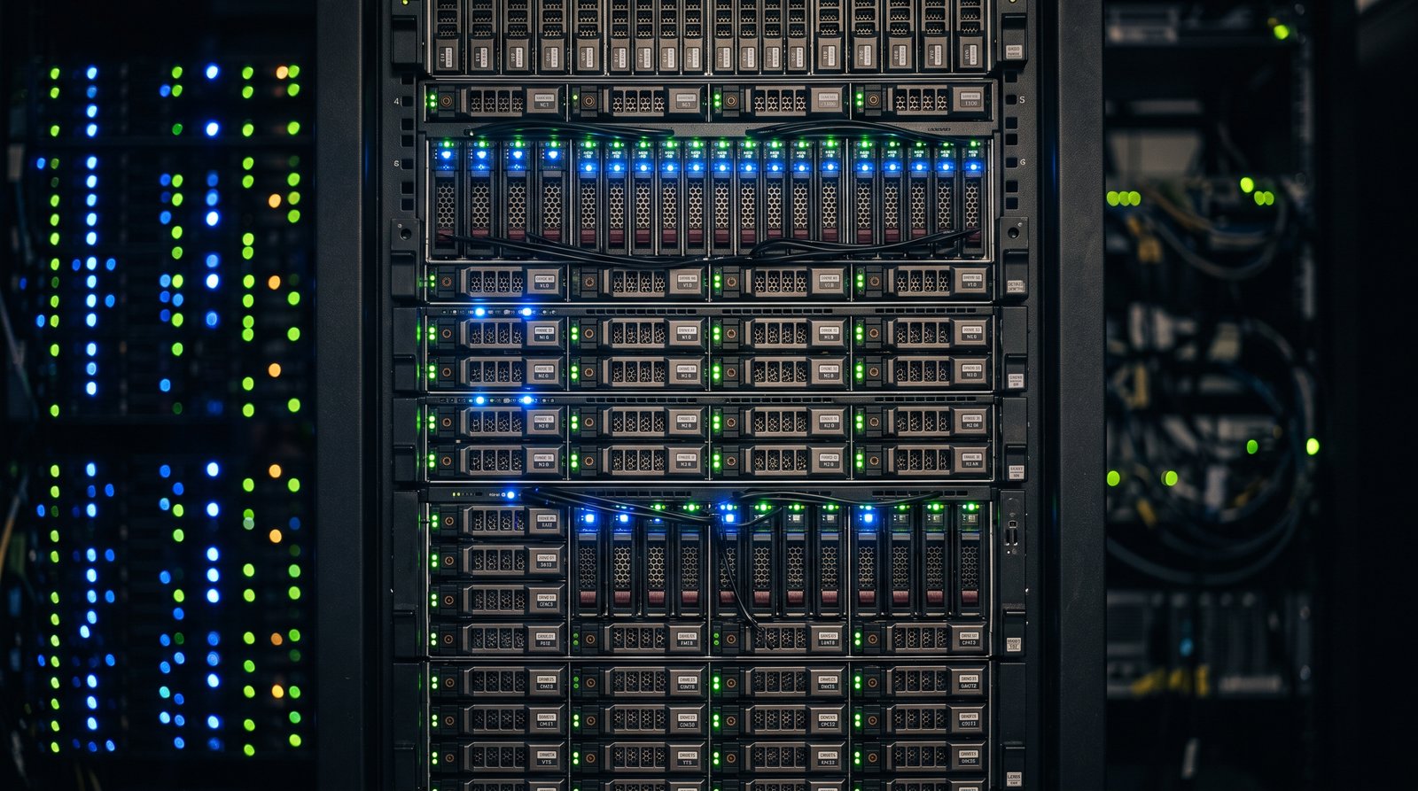 Server rack with blue indicator lights inside a business data room